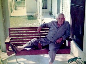 Pappaw on his front porch swing. He spent many hours there, waving to people passing by.